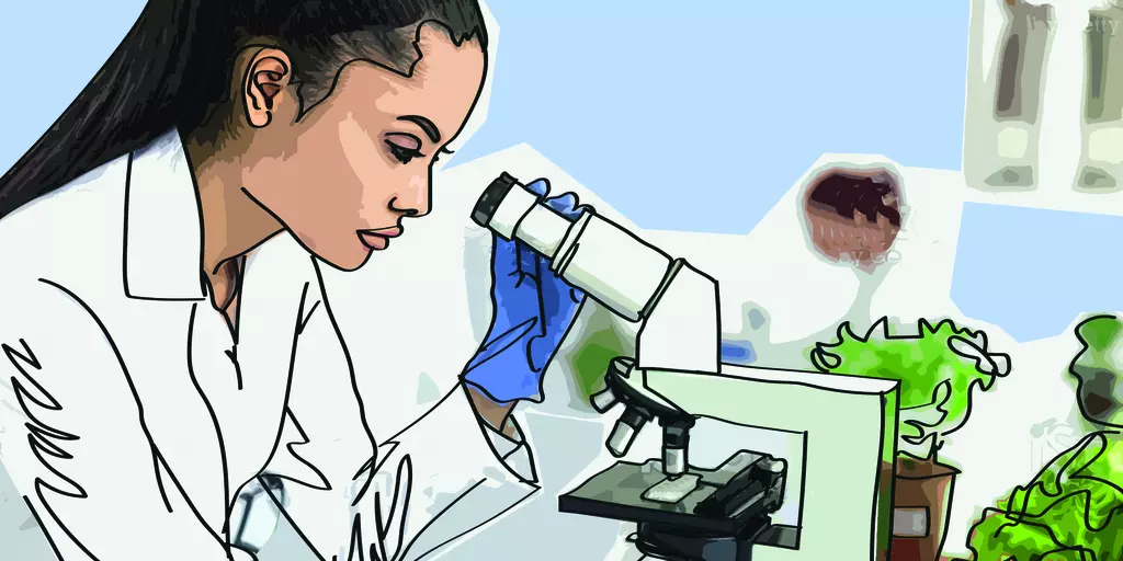 Female laboratory worker with microscope