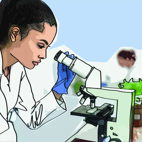Female laboratory worker with microscope